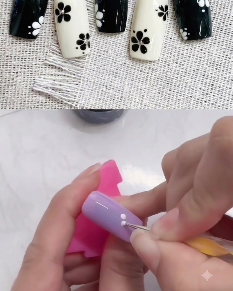 Un dotting tool aggiunge un secondo punto bianco adiacente al primo su ununghia viola.