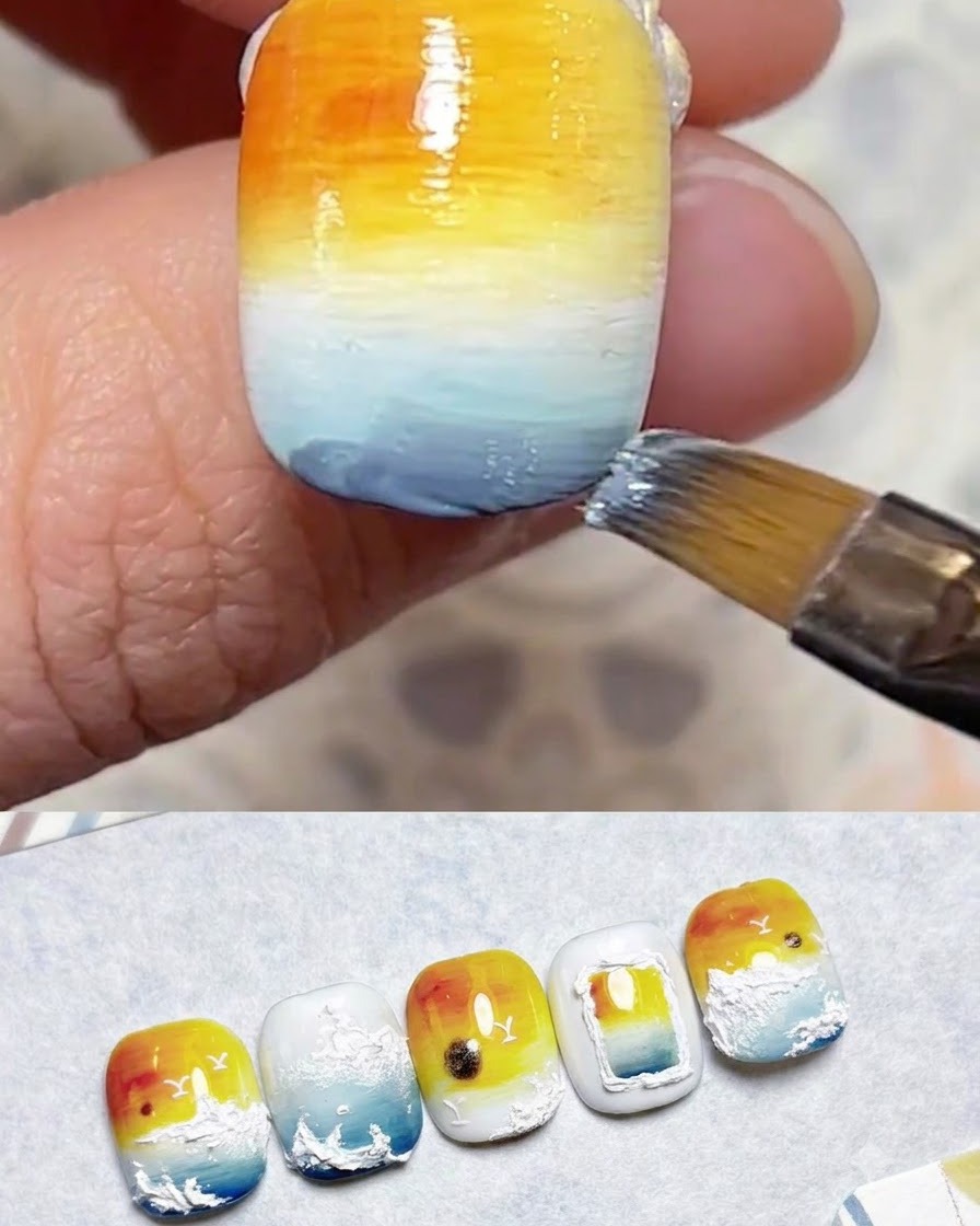 Un pennello che sfuma gli strati di gel blu sulla sezione inferiore dellunghia.