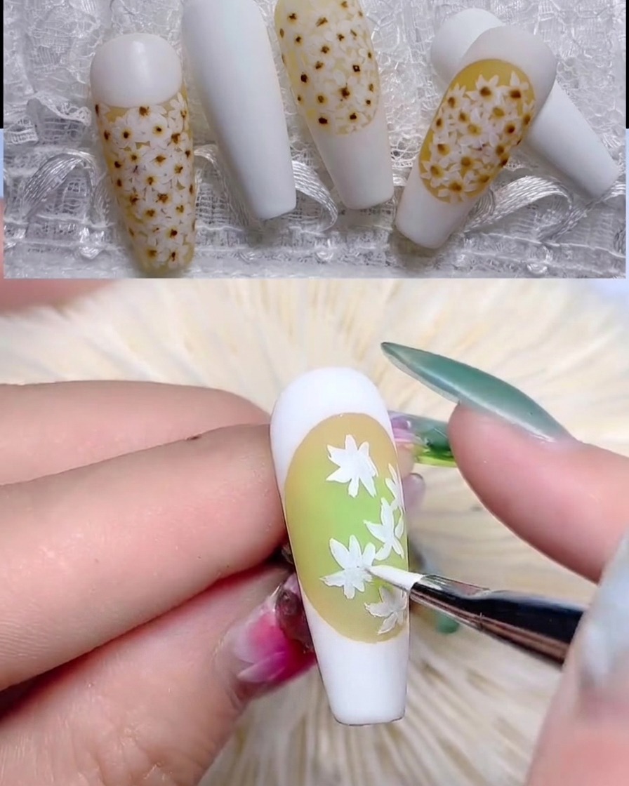 Un pennello sottile aggiunge petali bianchi dettagliati per completare il primo strato di margherite.