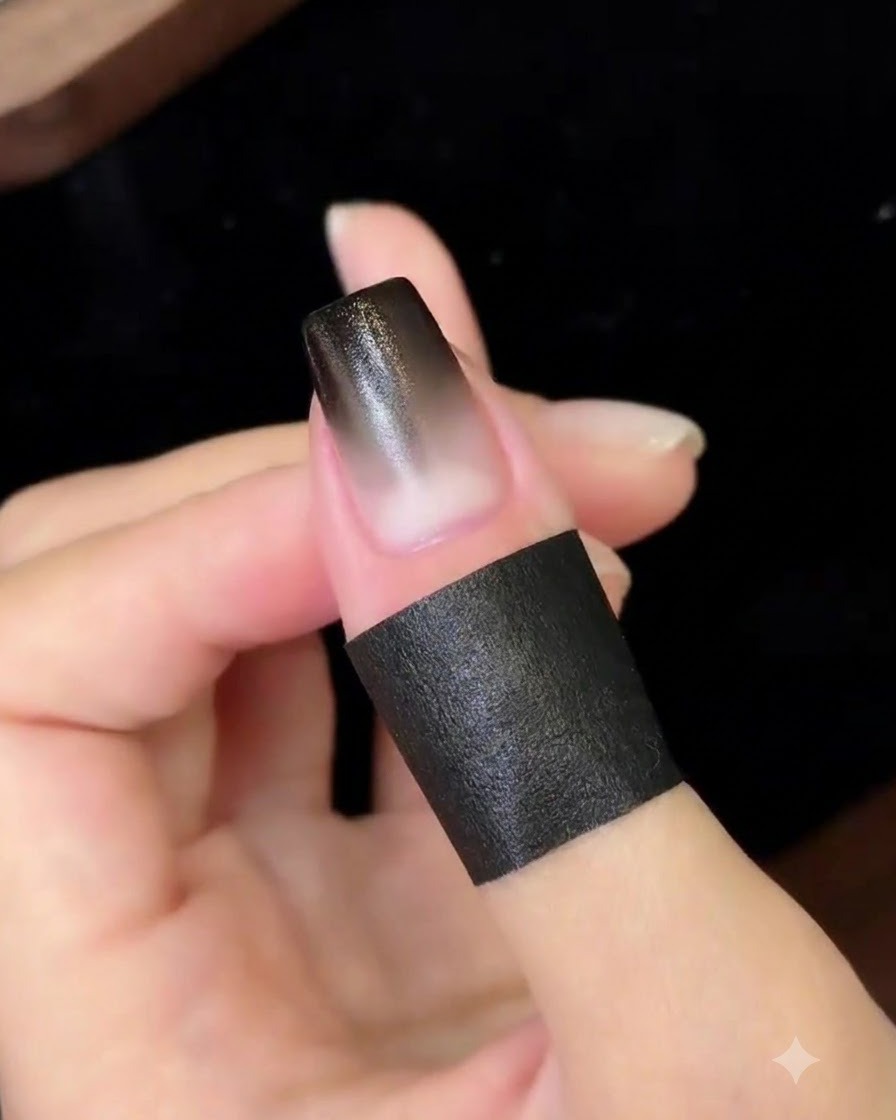 Ununghia sfumata finita che polimerizza sotto una lampada UV/LED compatta.