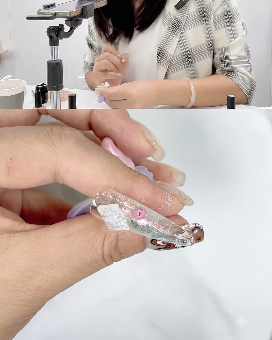 Primo piano di ununghia con petali di rosa parzialmente completati che polimerizzano sotto una lampada per unghie.