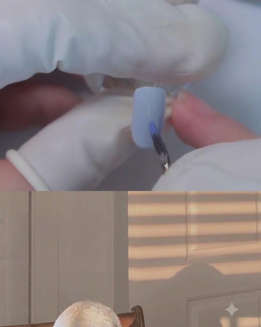 Un pennello fine che applica colore sullunghia del mignolo con il blooming gel.