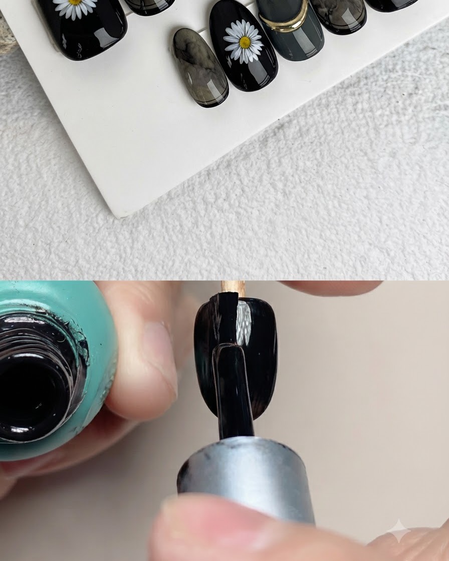 Primo piano di un pennello da unghie che applica petali bianchi su una superficie nera artificiale.