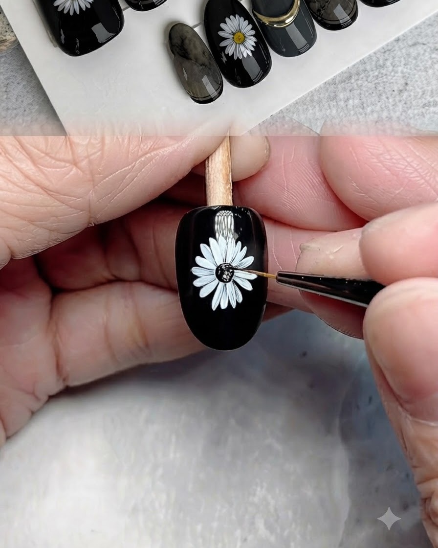 Un pennello fine che applica il gel nero al centro della margherita dipinta.