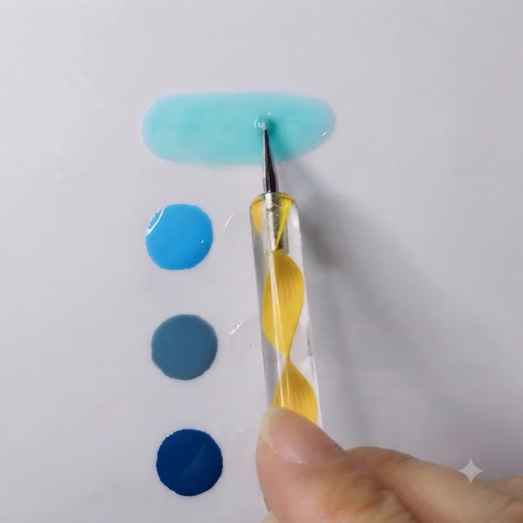 Un dotter che mescola un vivace gel blu cielo con gel trasparente formando una pozzanghera liscia e allungata.